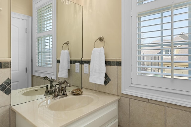 9812 Windrose Cir, Chattanooga, TN 37421 - bathroom with wainscoting, vanity, and tile walls