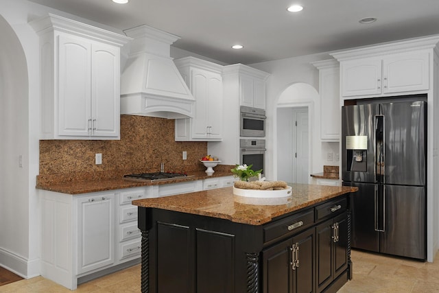 9812 Windrose Cir, Chattanooga, TN 37421 - kitchen featuring arched walkways, white cabinets, stainless steel appliances, and custom range hood