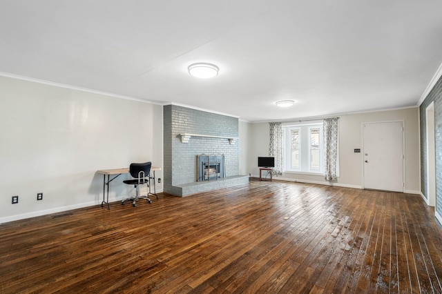 unfurnished living room with hardwood / wood-style floors, ornamental molding, baseboards, and a fireplace