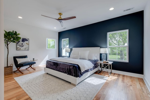 808A 45th Ave N, Nashville, TN 37209 - bedroom with baseboards, visible vents, multiple windows, and wood finished floors