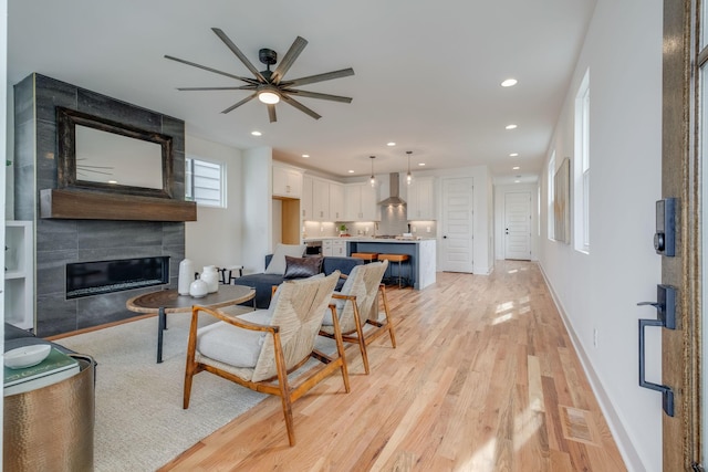 808A 45th Ave N, Nashville, TN 37209 - living area featuring a tile fireplace, a ceiling fan, light wood-type flooring, baseboards, and recessed lighting