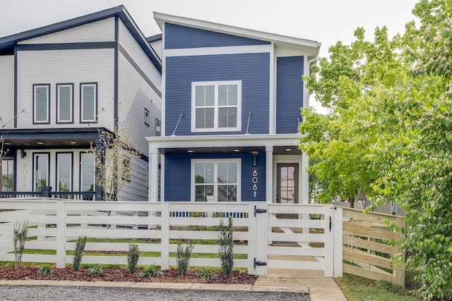 808A 45th Ave N, Nashville, TN 37209 - contemporary house featuring a gate, a fenced front yard, and a porch
