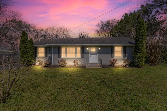 single story home with a front lawn