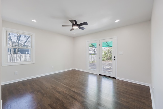 empty room with ceiling fan, baseboards, recessed lighting, and dark wood-style flooring