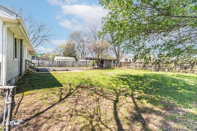 view of yard with a fenced backyard