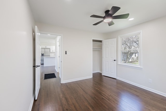 unfurnished bedroom with ceiling fan, a closet, recessed lighting, baseboards, and dark wood-style floors