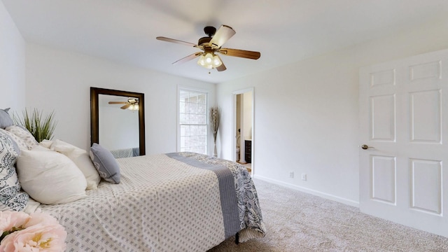 bedroom featuring baseboards, ceiling fan, and carpet floors