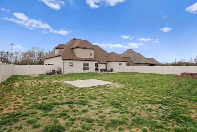view of yard with a fenced backyard and a patio area
