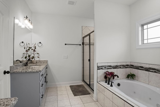 bathroom with tile patterned flooring, vanity, a shower stall, a tub with jets, and visible vents