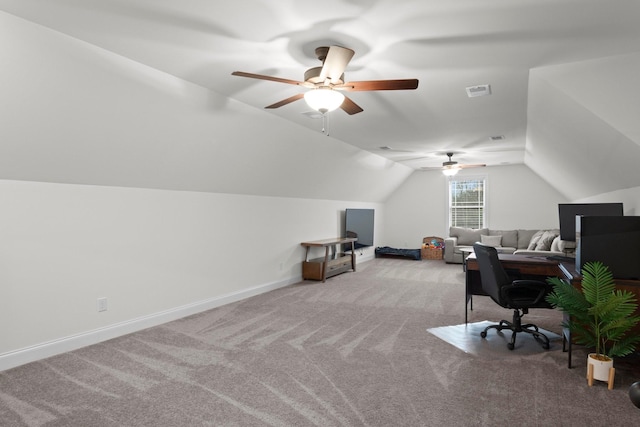 carpeted home office featuring a ceiling fan, baseboards, lofted ceiling, and visible vents