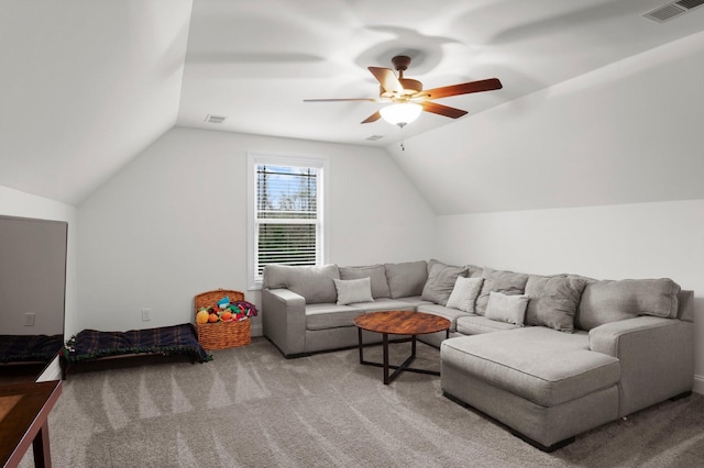 living room with ceiling fan, visible vents, and carpet