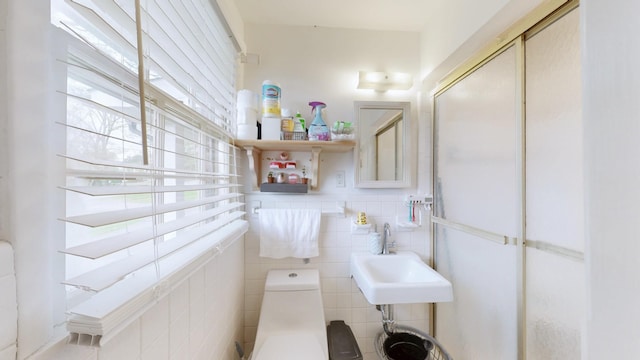 120 Gatone Dr, Hendersonville, TN 37075 - half bath featuring tile walls, a sink, toilet, and a healthy amount of sunlight