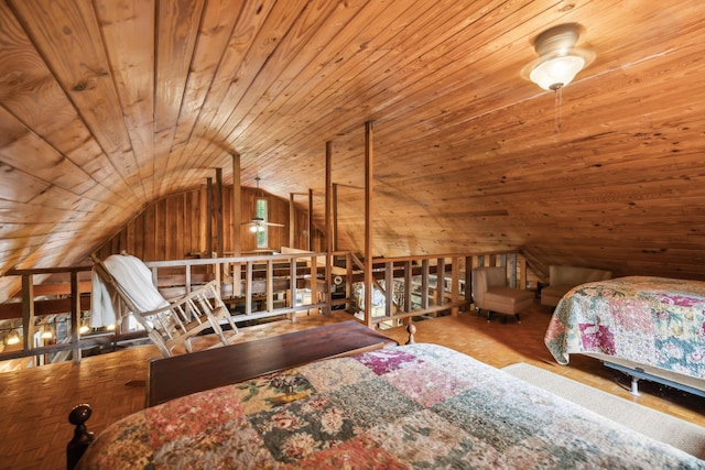 bedroom with vaulted ceiling, wooden ceiling, and wood walls