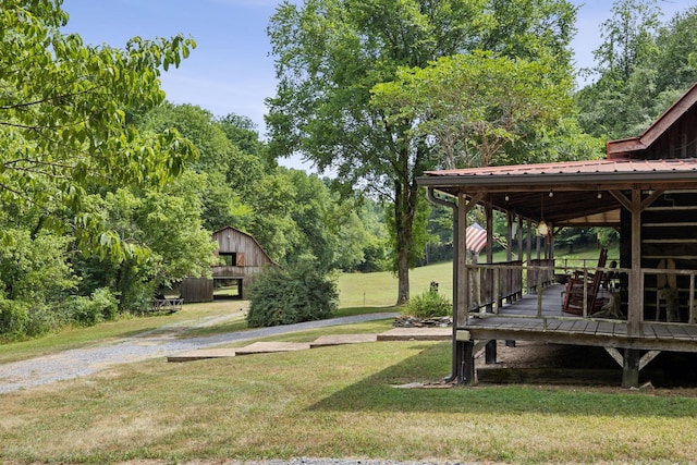 view of yard with an outbuilding and a barn