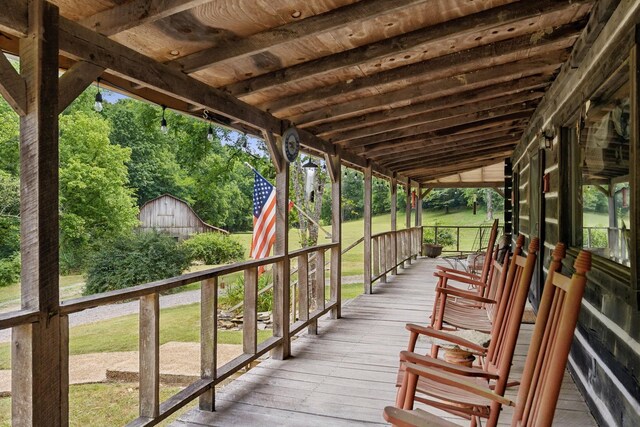 wooden deck featuring an outbuilding