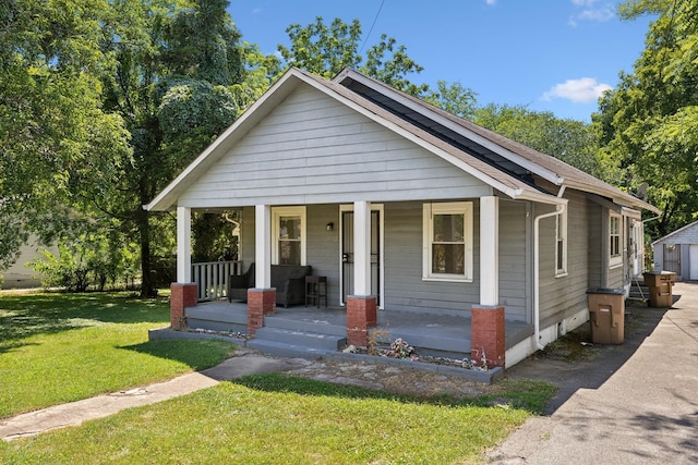 1902 Meridian St, Nashville, TN 37207 - bungalow featuring covered porch and a front lawn