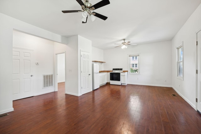 1902 Meridian St, Nashville, TN 37207 - unfurnished living room with baseboards, visible vents, dark wood-type flooring, and a ceiling fan