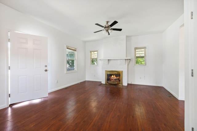 1902 Meridian St, Nashville, TN 37207 - unfurnished living room with a brick fireplace, visible vents, a ceiling fan, and hardwood / wood-style flooring