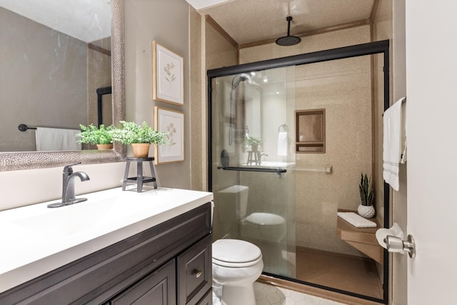 full bath featuring toilet, a stall shower, and vanity