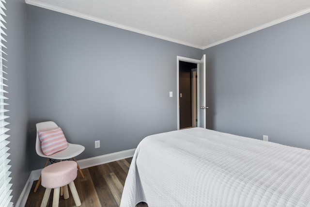 bedroom featuring baseboards, crown molding, and dark wood-type flooring