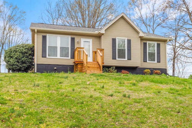 view of front of home featuring a front lawn and crawl space