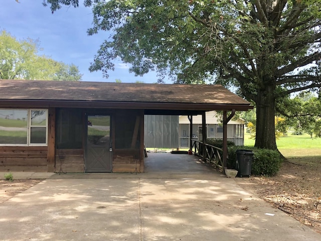 832 Pineview Dr, Springville, TN 38256 - view of home's community featuring an attached carport and driveway