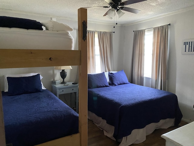 832 Pineview Dr, Springville, TN 38256 - bedroom with a textured ceiling, wood finished floors, and a ceiling fan