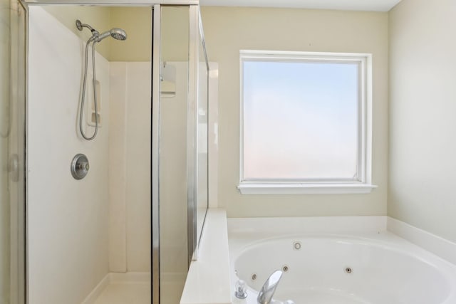 full bath with a whirlpool tub and a shower stall