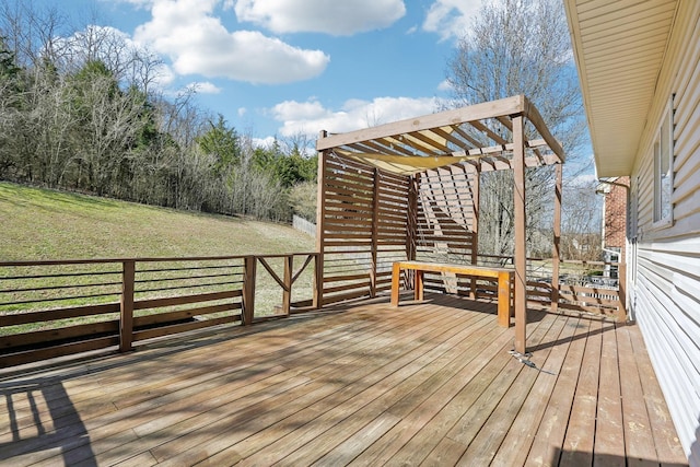 wooden deck with a pergola and a yard