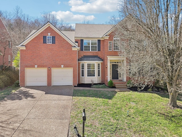 traditional home with an attached garage, brick siding, concrete driveway, and a front yard
