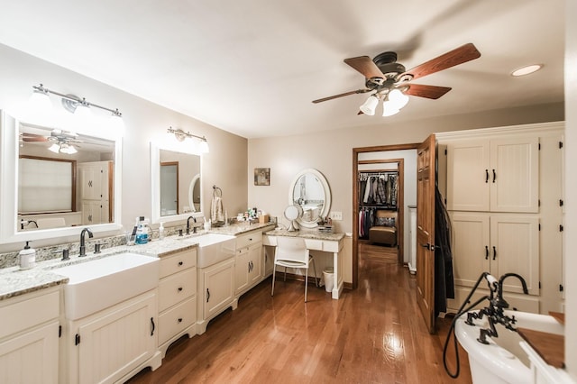 5267 Lickton Pike, Goodlettsville, TN 37072 - bathroom featuring vanity, wood finished floors, a freestanding tub, and a ceiling fan