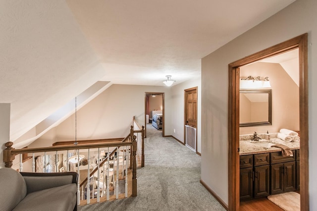 5267 Lickton Pike, Goodlettsville, TN 37072 - hallway with baseboards, lofted ceiling, a sink, and light carpet
