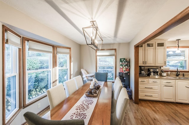 5267 Lickton Pike, Goodlettsville, TN 37072 - dining area featuring a notable chandelier, wood finished floors, and a textured ceiling