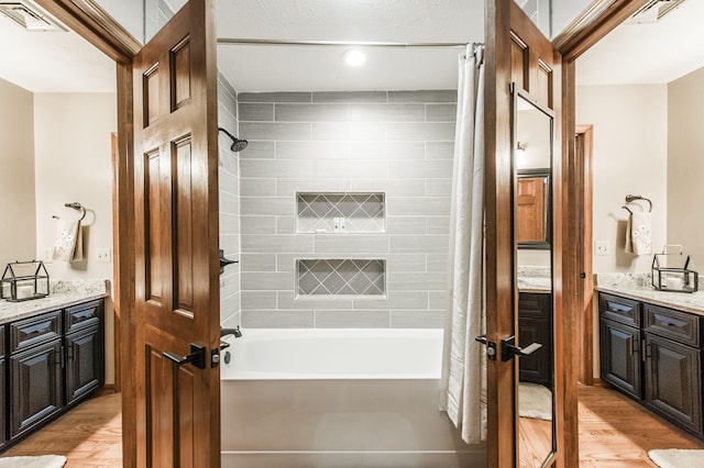 5267 Lickton Pike, Goodlettsville, TN 37072 - full bathroom featuring shower / tub combo, visible vents, wood finished floors, and vanity