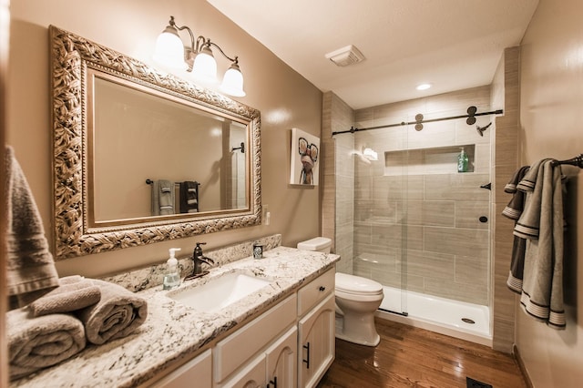5267 Lickton Pike, Goodlettsville, TN 37072 - bathroom with wood finished floors, vanity, toilet, and a shower stall