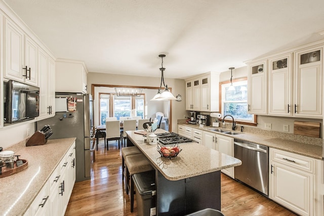 5267 Lickton Pike, Goodlettsville, TN 37072 - kitchen with a kitchen island, a sink, stainless steel dishwasher, and light wood-type flooring