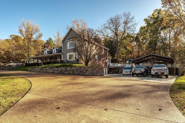 5267 Lickton Pike, Goodlettsville, TN 37072 - view of side of property featuring concrete driveway, a detached carport, and a lawn