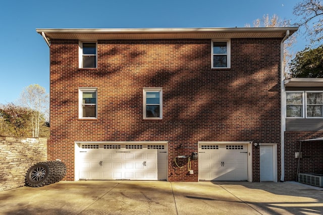5267 Lickton Pike, Goodlettsville, TN 37072 - rear view of property with driveway, brick siding, and a garage