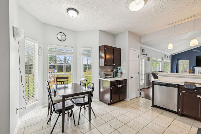 kitchen featuring dark brown cabinets, light tile patterned flooring, light countertops, dishwasher, and decorative light fixtures