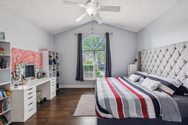 bedroom with baseboards, a ceiling fan, a textured ceiling, wood finished floors, and lofted ceiling