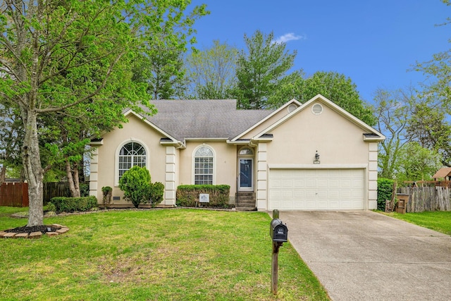 single story home with a garage, fence, stucco siding, a front lawn, and driveway