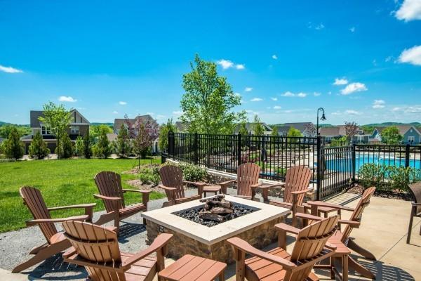 249 Moray Ct, Franklin, TN 37064 - view of patio featuring fence, a community pool, and a fire pit