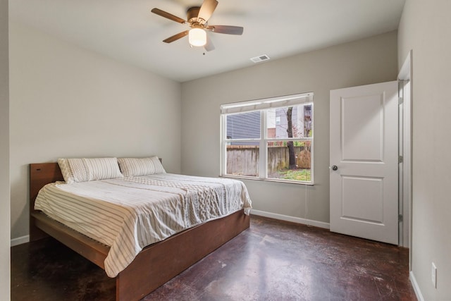 bedroom with a ceiling fan, concrete flooring, baseboards, and visible vents