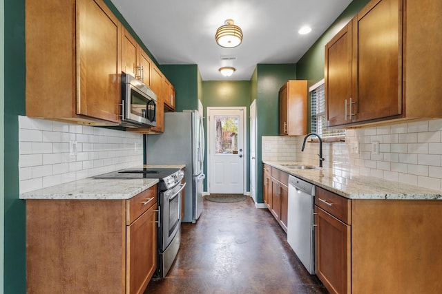 kitchen with finished concrete flooring, visible vents, light stone countertops, stainless steel appliances, and a sink