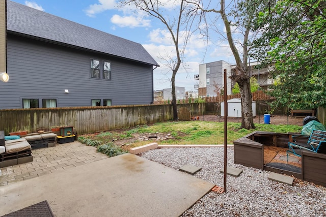 view of patio with a fenced backyard and an outdoor fire pit