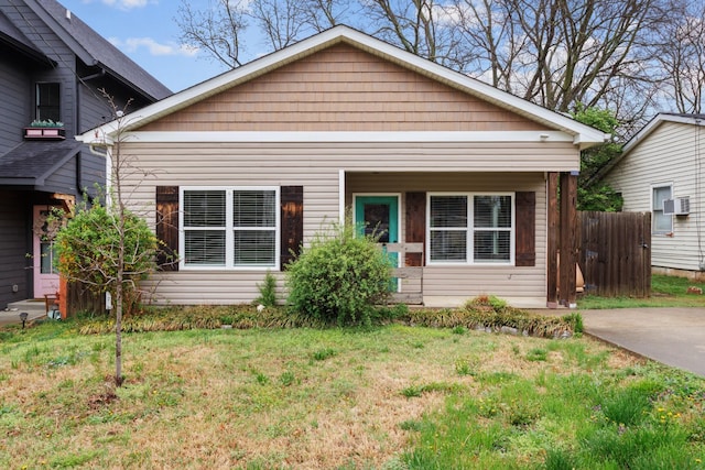 bungalow with a front yard