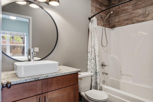 full bath featuring toilet, vanity, and shower / bathtub combination with curtain