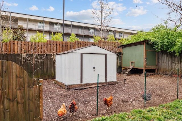 view of shed with fence