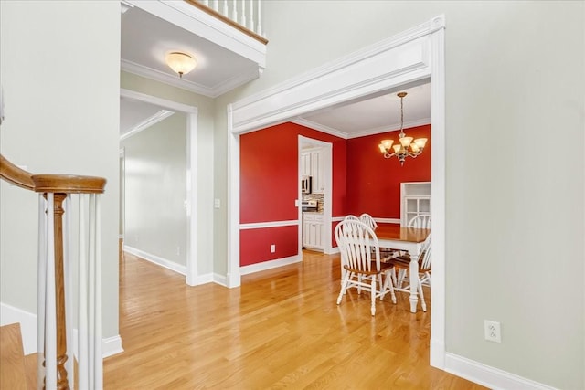 106 Irving Hills Ct, Lascassas, TN 37085 - dining space featuring a chandelier, crown molding, baseboards, and light wood finished floors