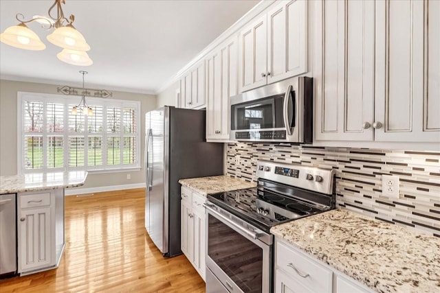 106 Irving Hills Ct, Lascassas, TN 37085 - kitchen with tasteful backsplash, crown molding, stainless steel appliances, light wood-style floors, and pendant lighting